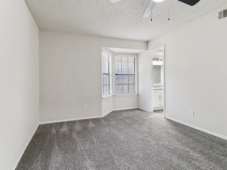B2 Main bedroom look to windows and bathroom