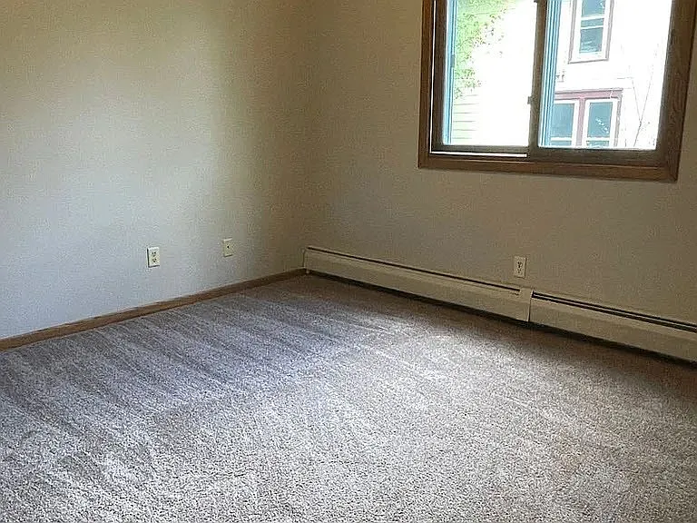 This spacious, sunlit room at LS Capital Group offers endless possibilities for your personal touch. With neutral tones and ample natural light, it's the perfect canvas for your vision. Schedule your tour today to see your new home!