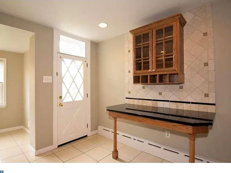kitchen with breakfast room and access to rear yard
