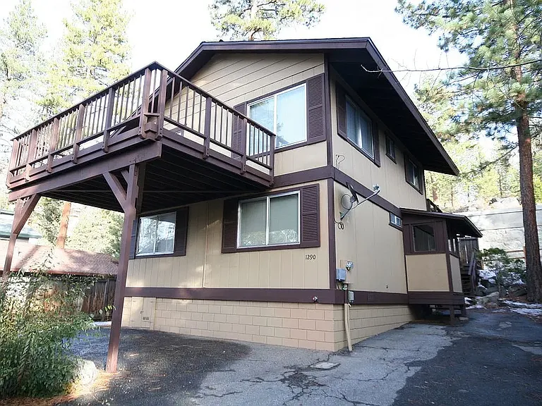 The home, taken from the beach easement / low road / driveway.