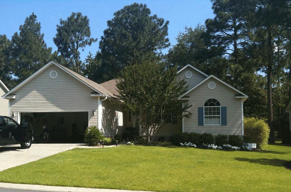 Home exterior featuring 2-car garage