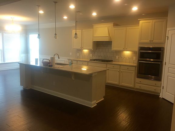 Large open kitchen complete with granite countertops