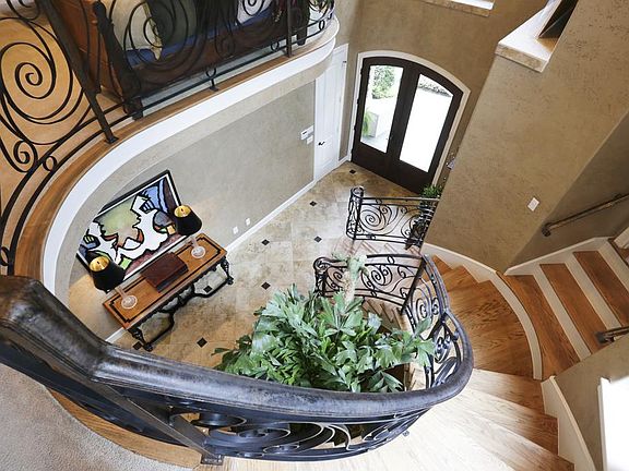 The set of 4 stairs off the main staircase lead to the homeÃ¢s one of a kind study. From this vantag