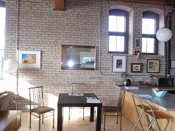 DEFINITELY DRAMATIC DINING surrounded by high ceilings,just off the kitchen!