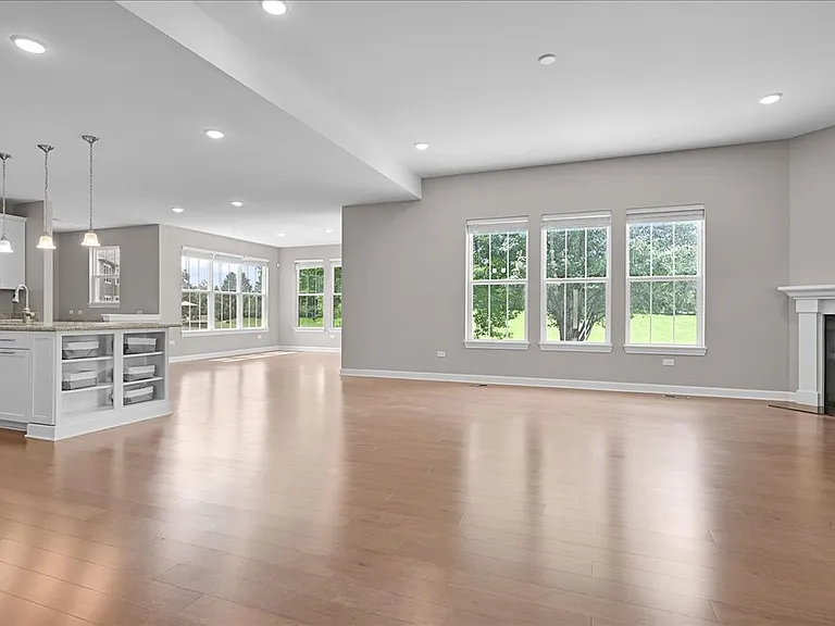 Open concept first floor with kitchen, dining room, and family room.