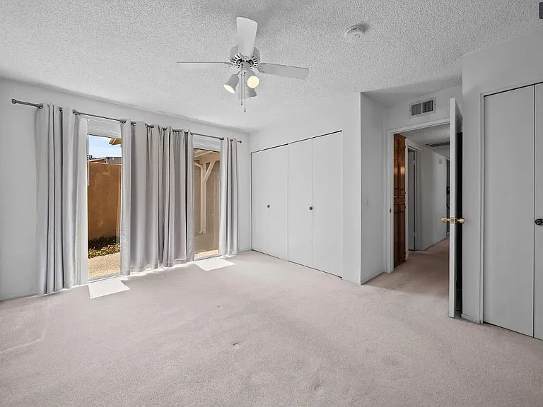 The master bedroom has been fully remodeled, featuring fresh paint, new LED lighting, updated flooring, and a ceiling fan with a remote control. It also includes a private bathroom that has been recently renovated.