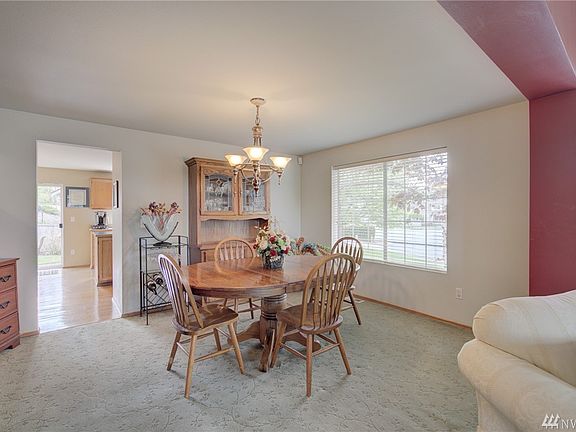 The dining room, adjacent to the formal living room, is quite spacious and can accommodate a large dining table plus room for a hutch or buffet.  