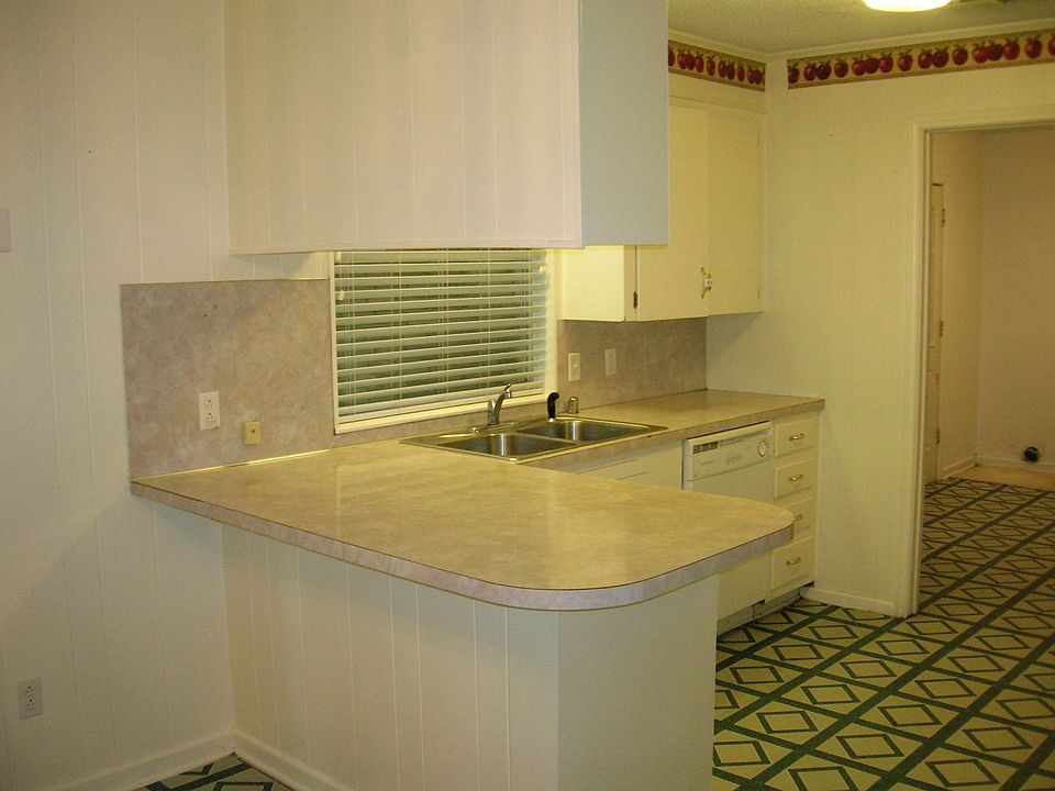 Kitchen overseen from dining area. 