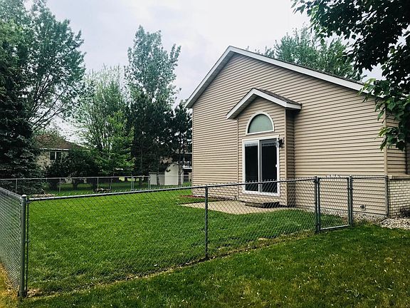 Fenced Side and Rear Yard. Walkout patio from Dining Room
