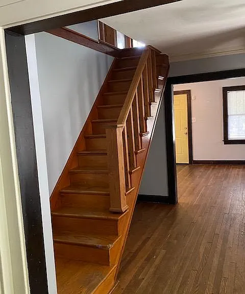 Beautiful wood front staircase to 2nd floor bedroom(s).