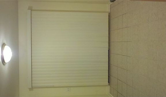 dining room / door leads outside behind blinds