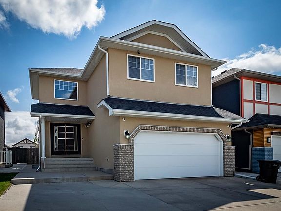 2nd image of 22 E Saddleland Cres NE