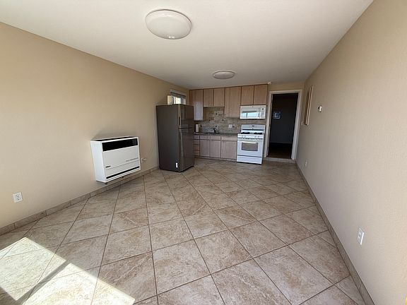 The main room...currently has a Mission style loveseat an rug in it...see last photo