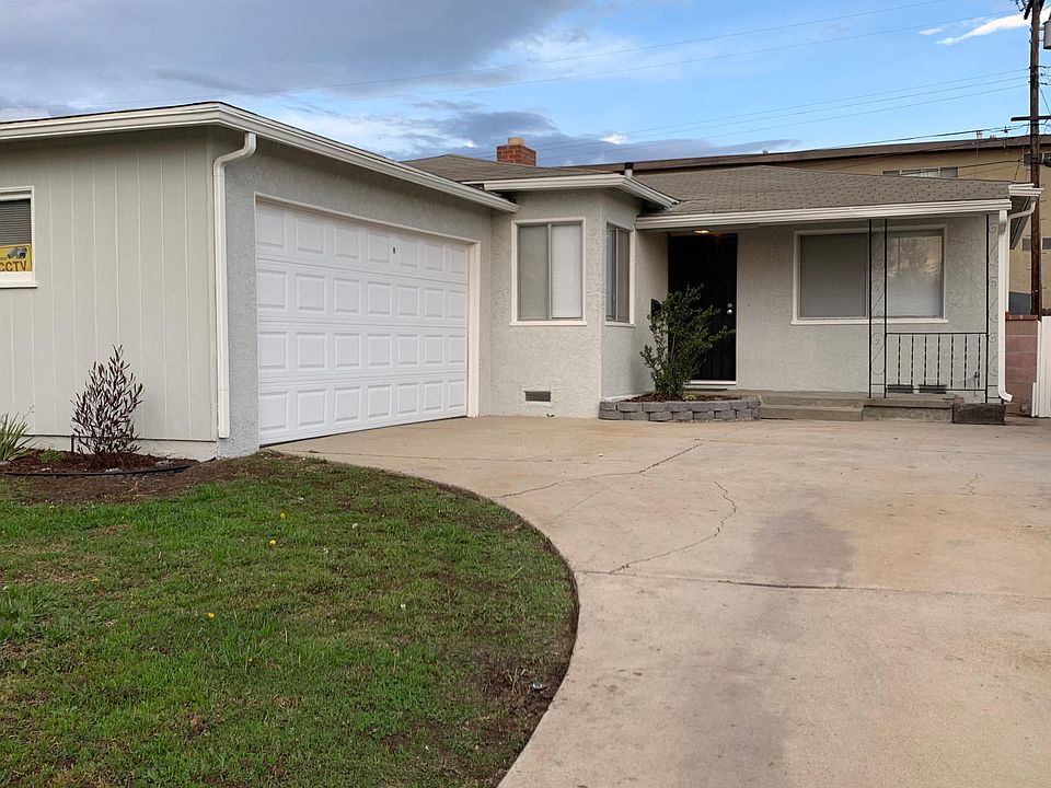 Driveway leading to the 2 car garage with remote access