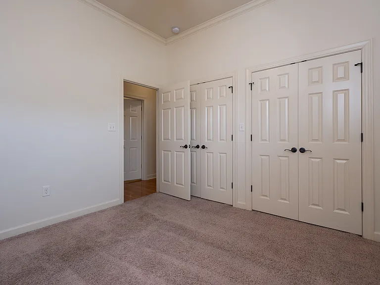 Bedroom #2 with two large closets or storage.