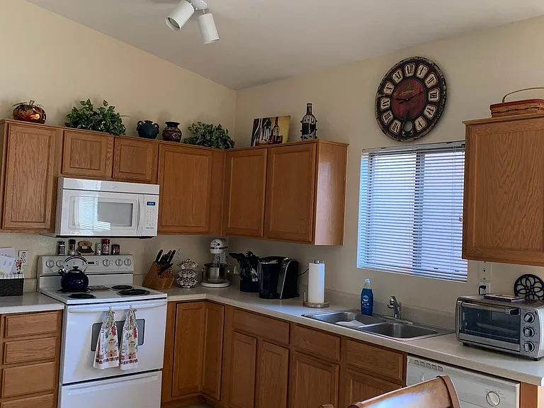 Kitchen. Appliances have all be replaced with new stainless steel Appliances since photo was taken.