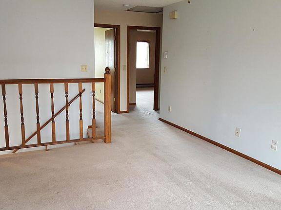 Upper living room looking toward stairs down to front door