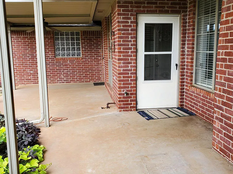 Back Patio, White Door From Dining Area
Door from Master Bed is in the corner
Divided-lite Window is over Master Tub
