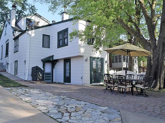 Original brick home was built in 1880.  There has been an add-on and now has a walk-out lower level that takes you to your paver