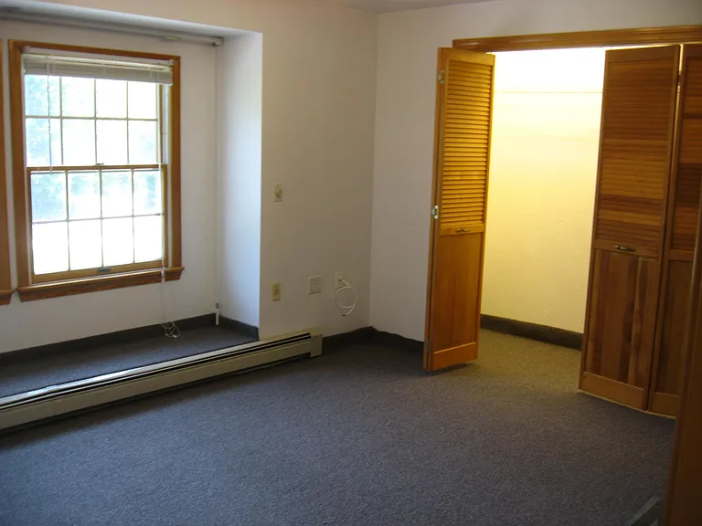 BEDROOM with wall to wall closet