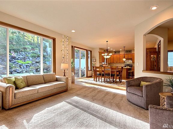Spacious, bright great room includes Mohawk carpet and pad