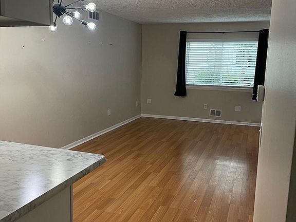large living room is open to the kitchen