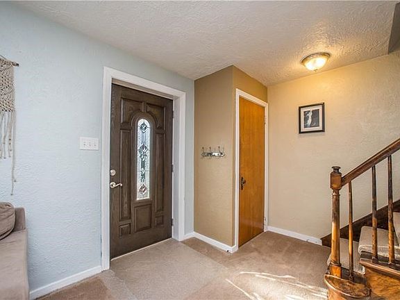 The new front door opens into the living area.  Coat closet is conveniently located next to the entry.