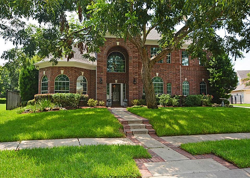 THIS CUSTOM BRICK BEAUTY IS SITUATED ON A SPACIOUS LOT IN A GATED COMMUNITY!