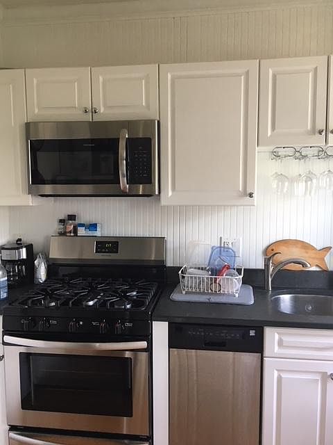 Kitchen with updated stainless steel appliances (Refrigerator, stove, Microwave, Dishwasher)