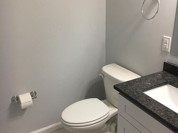 Powder room just off of living space makes for great separation of guest space from private space