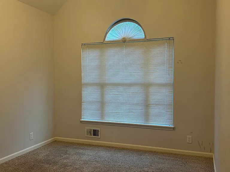 Another bedroom with cathedral ceiling.