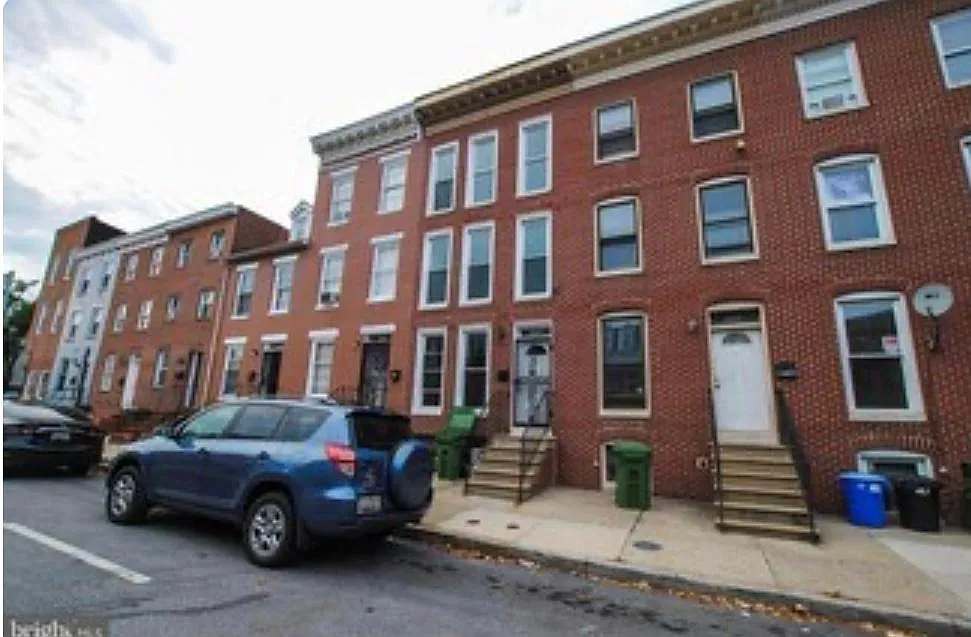 All brick exterior 
Extra windows for natural light! - 1034 W Lombard St