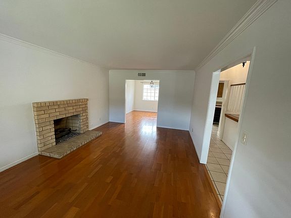 View of living Room to Dining Room and Entry Hall to Right