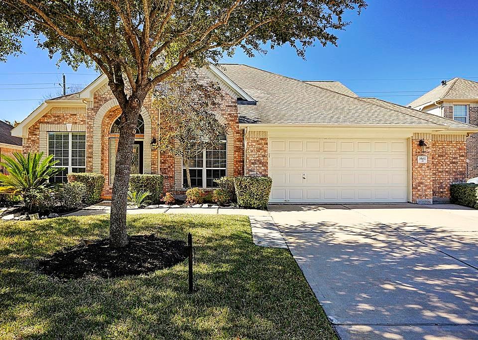 Rare 1.5 story with great curb appeal surrounded by wooded green space.