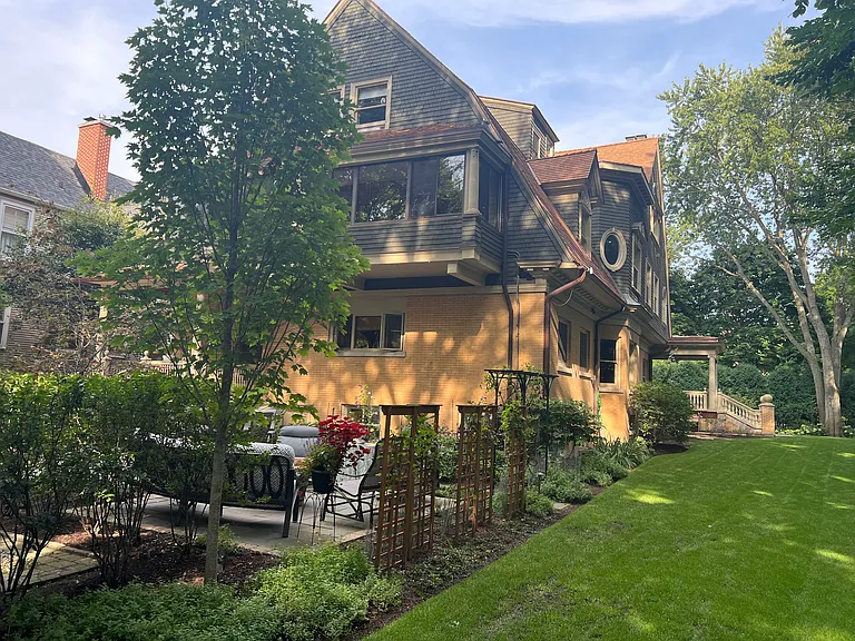 Rear view of property looking Northeast behind Patio and Parking area