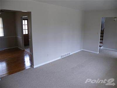 Berber carpet in living room.  Hardwoods in dining room as well as most of upper level.
