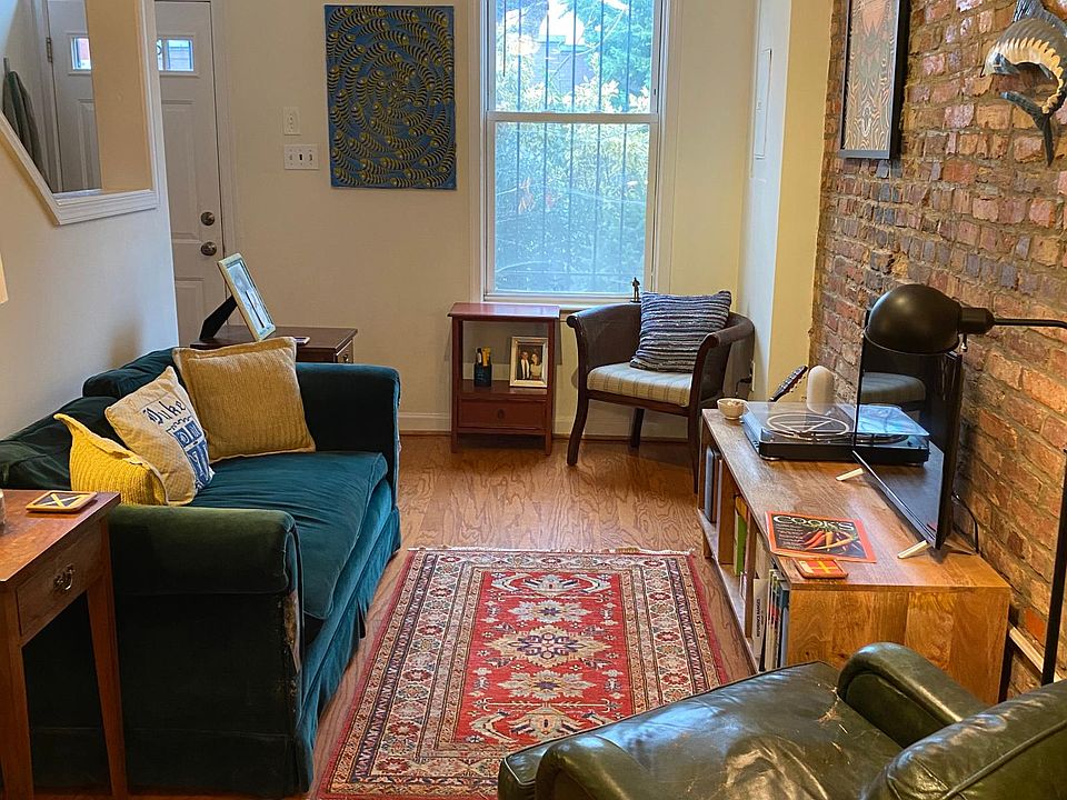 cozy living room with exposed brick