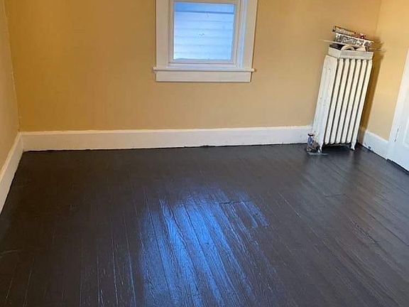 Third floor bedroom , one of two on third floor. Floors to be repainted and walls to be repainted .