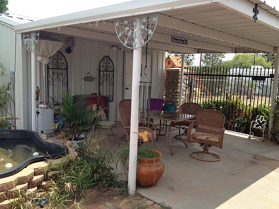 Back patio and storage bldg