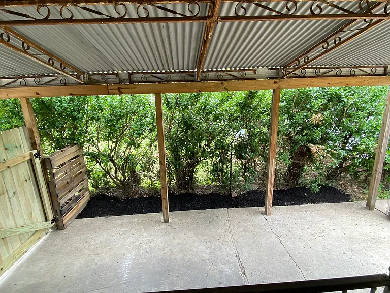 Covered Carport, leads to a back patio and fully fenced yard, including privacy fence.