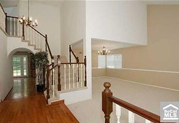 entry showing living room and dining room