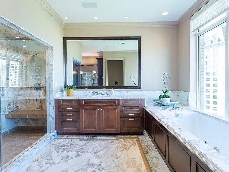 Calacatta Vagli marble floors and counters with Light Smoke Marble accents.