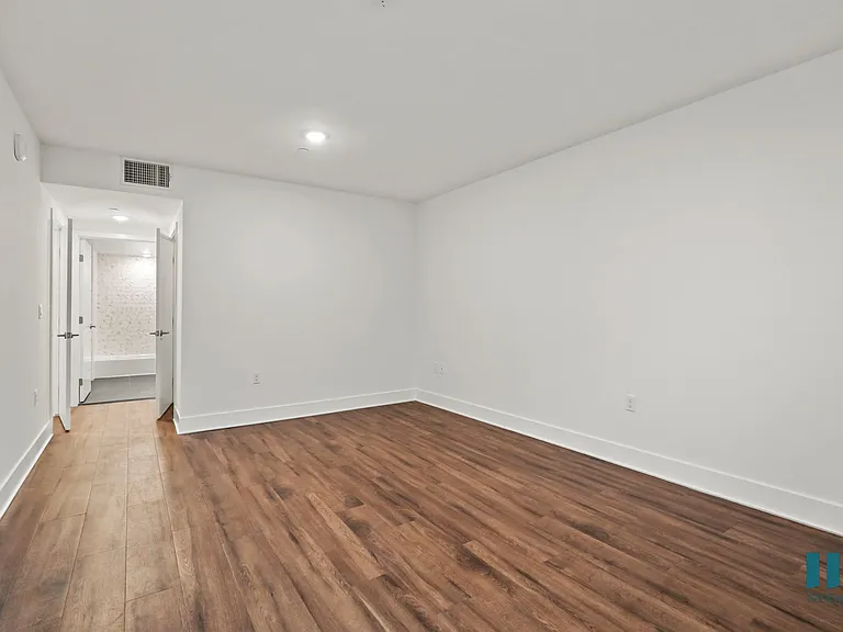 Bedroom with Recessed Lighting, Vinyl Flooring, and Bathroom
