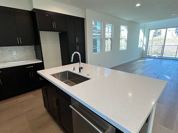 Island prep area with countertop for extra seating and working