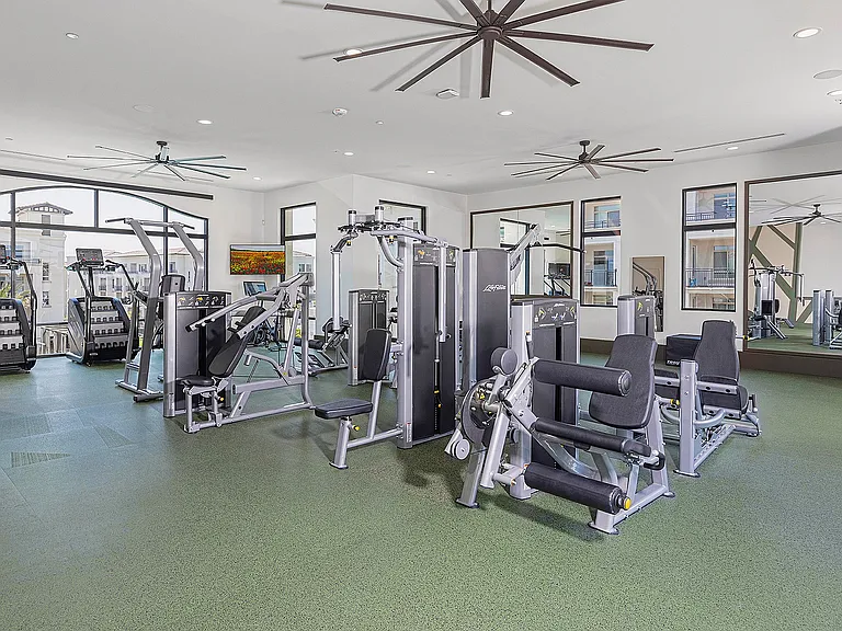 Two level fitness with weightlifting, TRX, Peloton Bike and Peloton Rower, Stair Climber, and more