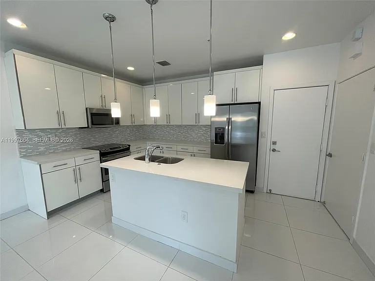 2621 NE 212th Ter #211 — Photo 2