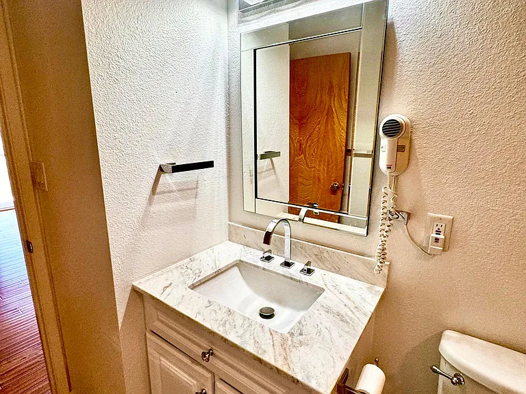 Guest bathroom between the two spare bedrooms. Design build walk in shower.