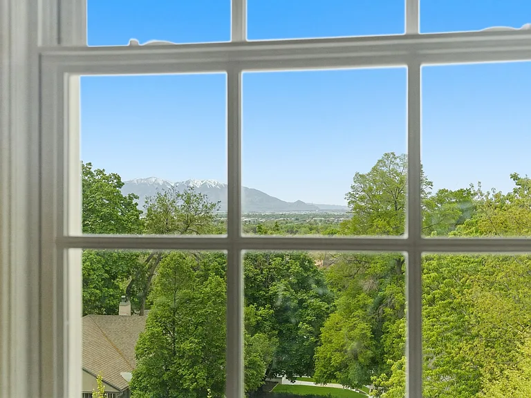 2nd bedroom upstairs with beautiful large windows facing the Salt Lake Valley.