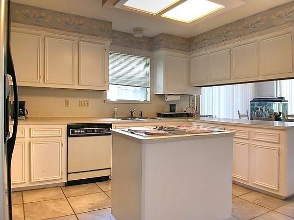 Kitchen with island and bar seating