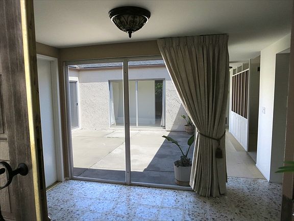 Entry with view of atrium